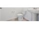 Well-maintained half-bathroom with modern fixtures and a pedestal sink at 4026 Copperleaf Ln, Poinciana, FL 34759