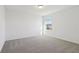Bedroom with neutral carpet, window, and natural light at 4026 Copperleaf Ln, Poinciana, FL 34759