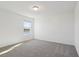 Bedroom features a bright window and neutral carpet at 4026 Copperleaf Ln, Poinciana, FL 34759