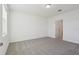 Spacious bedroom featuring plush carpeting and a neutral color palette for versatile decorating at 4026 Copperleaf Ln, Poinciana, FL 34759