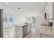 Open-concept kitchen with a large island, seamlessly connecting to the living area for easy entertaining at 4026 Copperleaf Ln, Poinciana, FL 34759