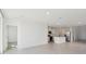 Open-concept living space with tile flooring, a kitchen island, and modern appliances at 4026 Copperleaf Ln, Poinciana, FL 34759