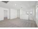 Upstairs loft area with neutral carpet and natural light at 4026 Copperleaf Ln, Poinciana, FL 34759