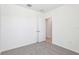 Neutral bedroom with plush carpet and an entry door and closet at 4031 Cooperleaf Ln, Poinciana, FL 34759