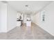 Modern kitchen featuring white cabinets, stainless steel appliances, and granite countertops at 4031 Cooperleaf Ln, Poinciana, FL 34759