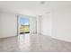 Spacious living room with tile flooring, a sliding glass door and lots of natural light at 4031 Cooperleaf Ln, Poinciana, FL 34759