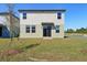 A lovely backyard with a grassy lawn and a patio area, perfect for outdoor enjoyment at 4034 Copperleaf Ln, Poinciana, FL 34759