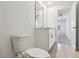 Half bathroom with a modern vanity, tiled floor and a neutral design at 4034 Copperleaf Ln, Poinciana, FL 34759