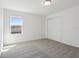 Bright bedroom with large window and closet with sliding doors at 4034 Copperleaf Ln, Poinciana, FL 34759