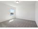 Brightly-lit bedroom with large window offering water views and plush carpeting at 4034 Copperleaf Ln, Poinciana, FL 34759