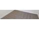 Close up of clean and neutral colored carpet with white trim at 4034 Copperleaf Ln, Poinciana, FL 34759
