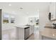 Eat-in kitchen featuring stainless appliances, dishwasher and a central island at 4034 Copperleaf Ln, Poinciana, FL 34759