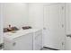 Well-lit laundry area features new white washer and dryer units at 4034 Copperleaf Ln, Poinciana, FL 34759