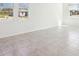 Spacious room with tile floors, white walls, and three large windows at 4034 Copperleaf Ln, Poinciana, FL 34759