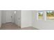 Bright room featuring tile floors, white walls, and two windows that let in natural light at 4034 Copperleaf Ln, Poinciana, FL 34759