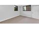 Well-lit bedroom features neutral carpet, modern windows, and a closet for storage solutions at 530 E Central Blvd # 102, Orlando, FL 32801