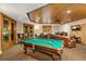 Spacious game room featuring a pool table, lounge area, and wood-paneled ceiling at 530 E Central Blvd # 102, Orlando, FL 32801