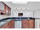 Kitchen counter featuring bar seating, stainless steel dishwasher, and pendant lighting at 530 E Central Blvd # 102, Orlando, FL 32801