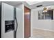 Stainless steel refrigerator with built-in water dispenser next to a closet door, with an open layout and tile floor at 530 E Central Blvd # 102, Orlando, FL 32801