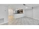 Spacious living room featuring an open-concept design with a pass-through bar to the kitchen at 530 E Central Blvd # 102, Orlando, FL 32801