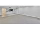 Open-concept living room with neutral carpeting, a breakfast bar overlooking the kitchen, and recessed lighting at 530 E Central Blvd # 102, Orlando, FL 32801