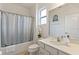 Clean bathroom with shower/tub combo, vanity, and updated fixtures at 5414 Oakgrain Ct, Davenport, FL 33837