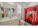 Bathroom with white vanity, toilet, and a spider-themed shower curtain at 5414 Oakgrain Ct, Davenport, FL 33837
