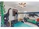 Dinosaur-themed bedroom with twin-sized beds, featuring dinosaur wall art at 5414 Oakgrain Ct, Davenport, FL 33837