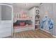 Charming bedroom with a custom bunk bed and Cinderella mural at 5414 Oakgrain Ct, Davenport, FL 33837