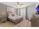 Elegant main bedroom with a king-size bed and modern decor at 5414 Oakgrain Ct, Davenport, FL 33837