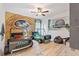 Dinosaur-themed bedroom with twin-sized beds and jeep-shaped bed frames at 5414 Oakgrain Ct, Davenport, FL 33837