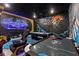 Game room with Batman theme, featuring pool table and air hockey at 5414 Oakgrain Ct, Davenport, FL 33837