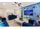 Gathering room boasts a Neverland theme, large TV, and jukebox at 5414 Oakgrain Ct, Davenport, FL 33837