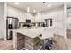 Modern kitchen with stainless steel appliances and a large island at 5414 Oakgrain Ct, Davenport, FL 33837
