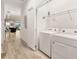 Laundry room with side-by-side washer and dryer, and access to living area at 5414 Oakgrain Ct, Davenport, FL 33837