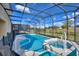 Inviting screened pool and spa with ample outdoor space at 5414 Oakgrain Ct, Davenport, FL 33837