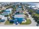 Aerial view of a blue house with a car in the driveway at 6815 Engram Rd, New Smyrna Beach, FL 32169