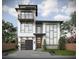 Modern two-story home with a gray garage door and balcony at 6815 Engram Rd, New Smyrna Beach, FL 32169