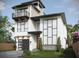 Modern two-story home with a gray garage door and balcony at 6815 Engram Rd, New Smyrna Beach, FL 32169