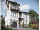 Modern two-story home with a gray garage door and balcony at 6815 Engram Rd, New Smyrna Beach, FL 32169