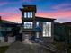 Modern three-story home with dark gray exterior at 6815 Engram Rd, New Smyrna Beach, FL 32169