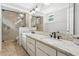 Bathroom featuring double sinks, a granite countertop, tiled floors, and a stand up shower at 7943 Snowberry Cir, Orlando, FL 32819