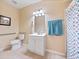 Accessible bathroom featuring a white vanity and shower stall at 8013 Cool Breeze Dr # 116, Orlando, FL 32819