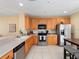 Well-equipped kitchen featuring wood cabinets and stainless steel appliances at 8013 Cool Breeze Dr # 116, Orlando, FL 32819