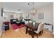 Open living and dining area with hardwood floors and comfortable furniture at 8013 Cool Breeze Dr # 116, Orlando, FL 32819