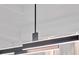 Close-up of a modern, linear light fixture with sleek design elements and soft lighting at 8519 Saint Marino Blvd, Orlando, FL 32836