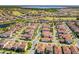 Extensive view of a neighborhood near a golf course, various ponds and lakes, and lush greenery at 10231 Beechwood Ln, Orlando, FL 32832