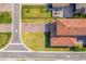 Aerial view of a home with a tile roof, brick driveway, and well-maintained landscaping at 10231 Beechwood Ln, Orlando, FL 32832