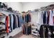 Well-organized walk-in closet featuring ample storage space for clothing and accessories at 10231 Beechwood Ln, Orlando, FL 32832