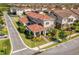 Stunning two-story home featuring a red tile roof and manicured landscaping at 10231 Beechwood Ln, Orlando, FL 32832